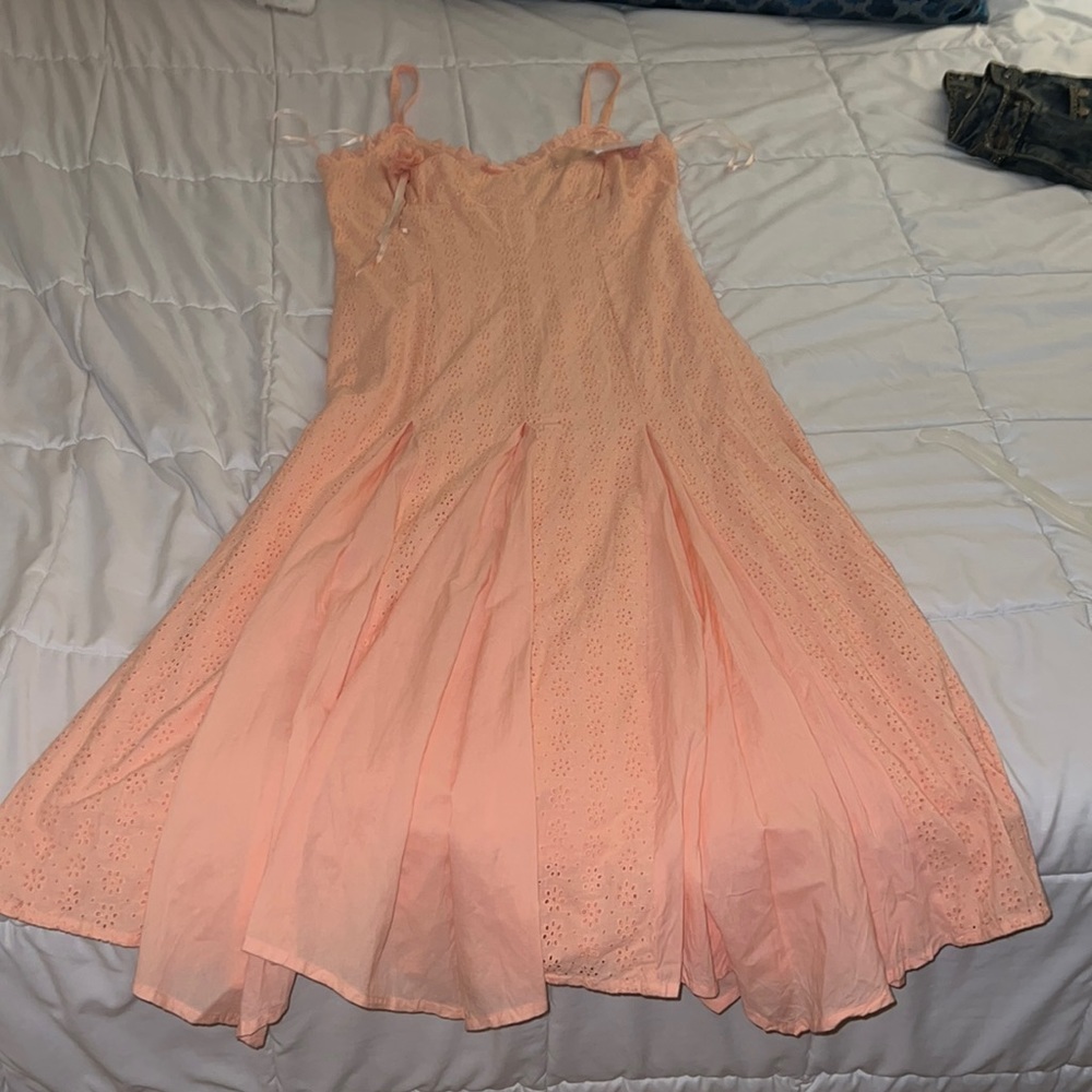 Peach long dress that flares at the bottom